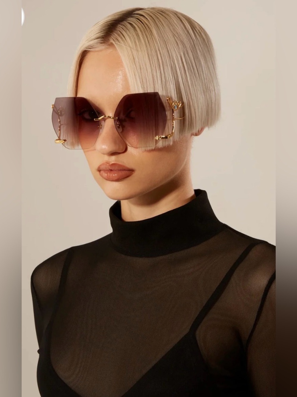 For Art’s Sake 18k gold plated sunglasses with eye design